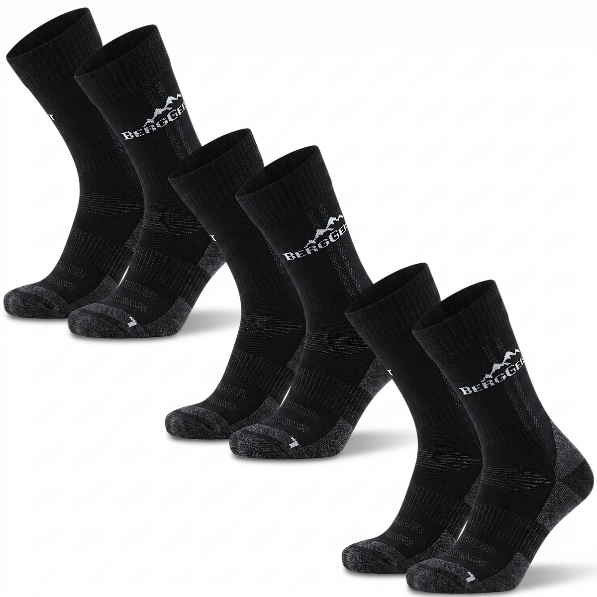 Drei Paar schwarze Merino Wandersocken mit grauer Ferse und Spitze vor weißem Hintergrund